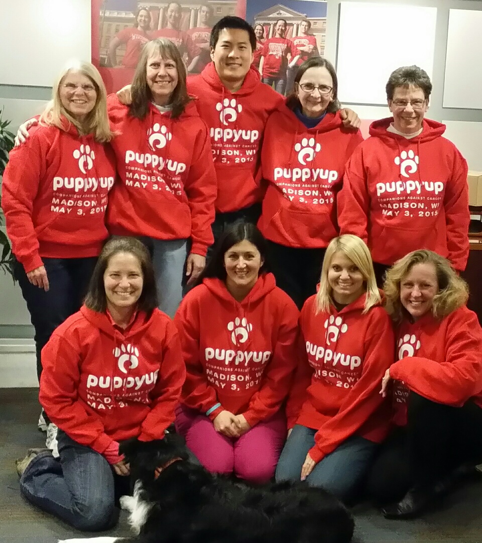 PuppyUp Madison Back Row, left to right: Mary Ann Francis, Dr. Linda Sullivan, Dr. Kai Shiu - Co-Chair, Diane Peltin, Vicki Nussbaum. Front Row, left to right: Ann Lippincott, Our canine team mascot and cancer survivor, Valiant Ms. V, Lana Chute, Melanie Taylor, Beth Viney - Co-Chair Missing from team photo; Sam Taylor and Bonnie Cubalchini