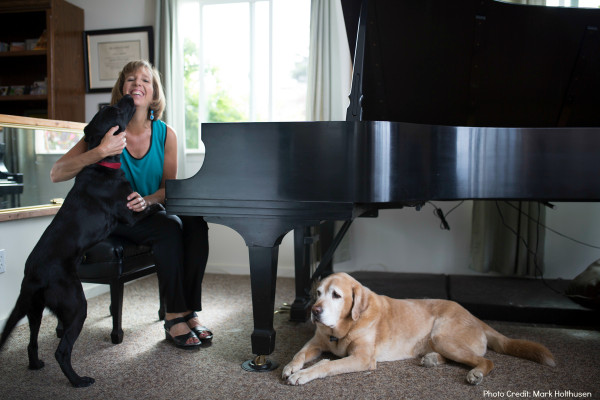 Lisa with her dogs Gina and Sanchez. Photo by Mark Holthusen.
