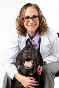 COURTESY OF ANIMAL SPECIALTY & EMERGENCY CENTER Veterinary cancer specialist Dr. Sue Ettinger will host a program Friday night in Watertown that will be sponsored by Paws 4 Potter. She poses with Matilda, her black Labrador.