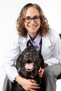  COURTESY OF ANIMAL SPECIALTY & EMERGENCY CENTER Veterinary cancer specialist Dr. Sue Ettinger will host a program Friday night in Watertown that will be sponsored by Paws 4 Potter. She poses with Matilda, her black Labrador.