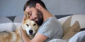 Man hugging dog