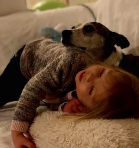 Josie the dog and 2-year-old Charlotte. Photo: Wes and Heidi Robertson