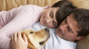 Couple-and-loving-dog