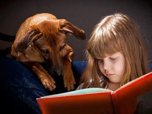 child reading to dog