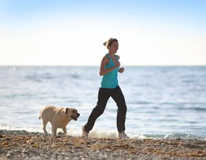 veterinary_woman running with dog_main