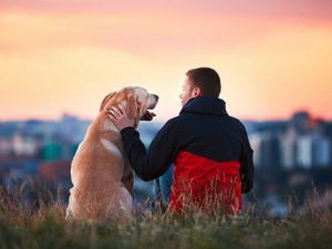 Man Sitting With His Dog-Article